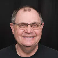 a man with new smile grinning