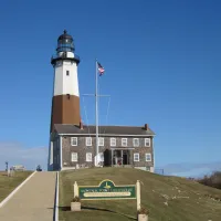 Montauk Point Light that has a sign on the side of a road