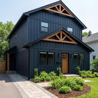 Before and after images of a house showing transformation from faded blue siding to modern dark blue exterior with wood accents.