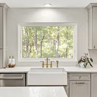 a kitchen with white cabinets