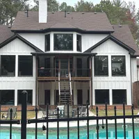 a house with a pool in front