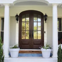 a house with a large door and white pillars