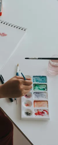 a person writing on a white board