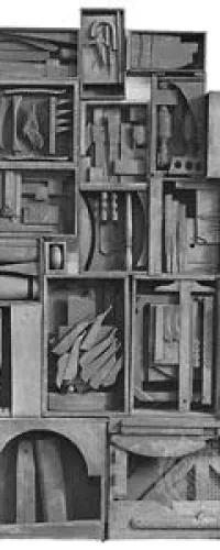 Black and white photo of an abstract wooden relief sculpture with geometric and organic shapes arranged in compartments.