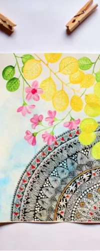 Colorful mandala watercolor painting with green leaves, pink flowers, paint palette, and cup of tea on white background.