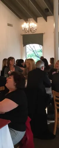 a group of people sitting at tables