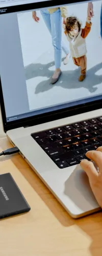 a person typing on a laptop