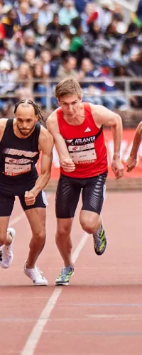 a group of people running on a track