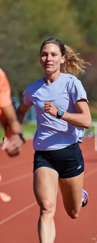 a woman running on a track