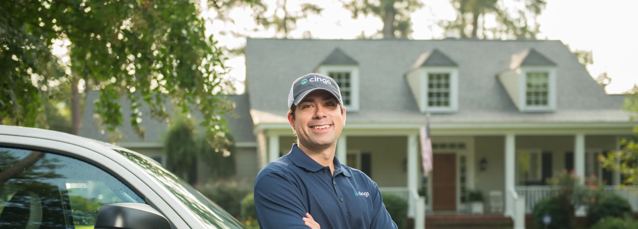 a man standing next to a car