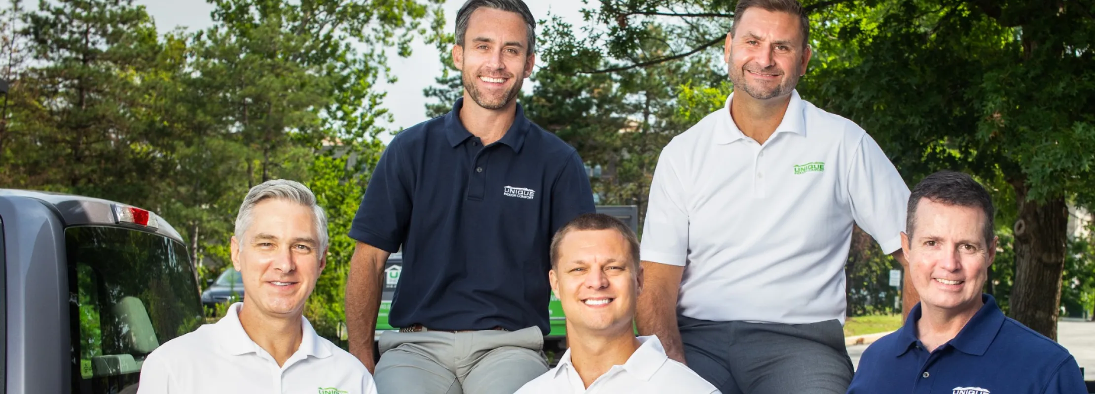 a group of men posing for a photo