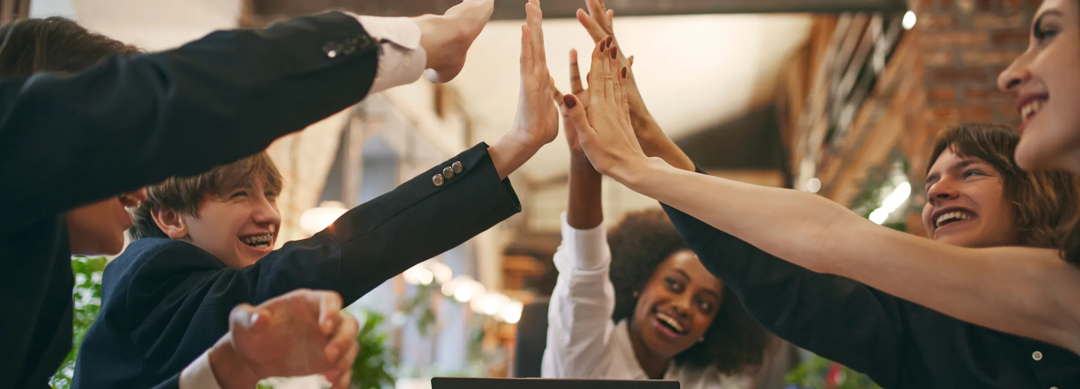 a group of people raising their hands