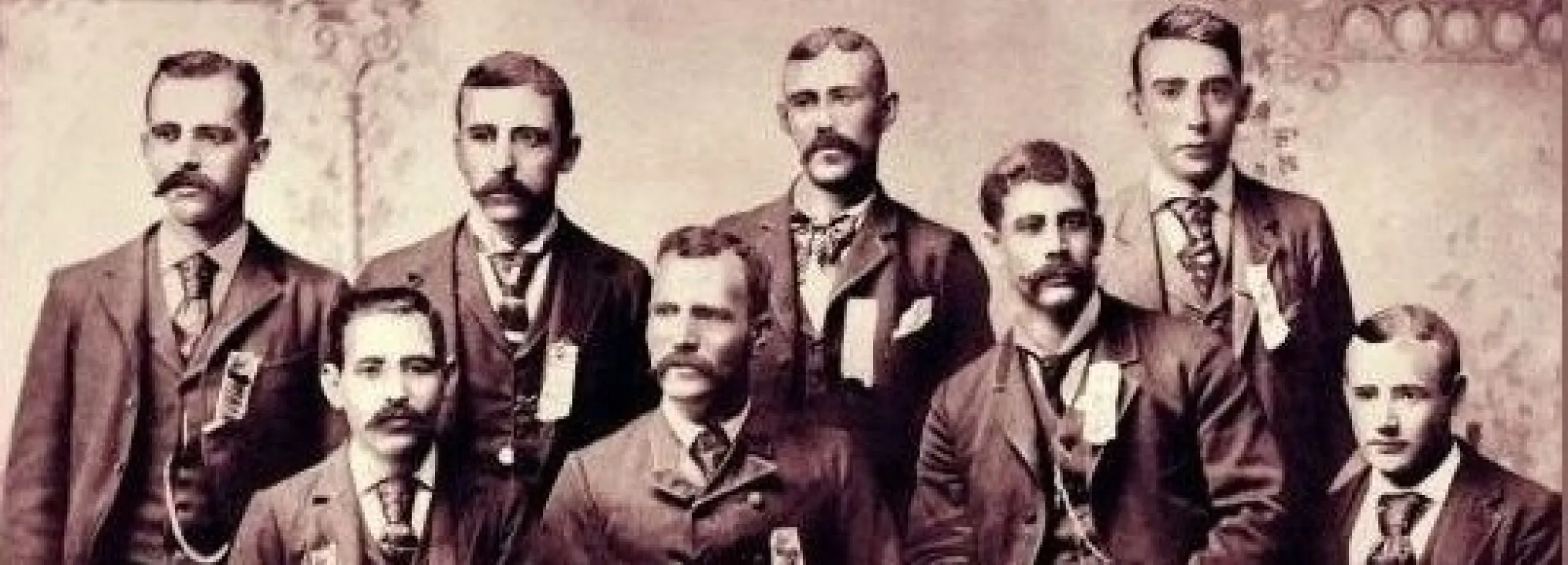 a group of men posing for a photo