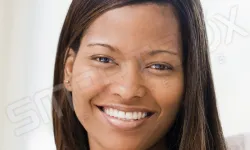 Thumbnail control image for a woman smiling for the camera