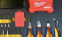 Thumbnail control image for Set of Milwaukee hand tools including pliers, sockets, and red storage cases neatly arranged on a black surface
