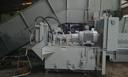 Thumbnail control image for Industrial hydraulic power unit with motor, hoses, and control components in factory setting.
