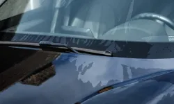 Thumbnail control image for Side-by-side comparison of a dirty car windshield and hood versus the same car clean and shiny after washing.