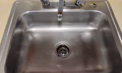 Thumbnail control image for Stainless steel sink showing faucet and drain after cleaned by MaidPro Asheville