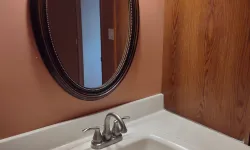 Thumbnail control image for a bathroom sink with a mirror above it cleaned by MaidPro Orland Park