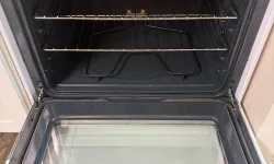 Thumbnail control image for Open oven showing clean interior and transparent door cleaned by MaidPro Salem