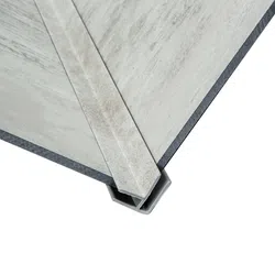 Close-up of metal corner joint connecting two structural panels with a reinforcing metal brace on a white background.