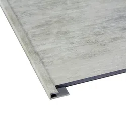 Close-up of a gray laminate flooring edge with a matching metal extrusion trim attached.
