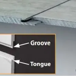Close-up of tongue and groove joint in wooden boards illustrating interlocking edges for secure fitting.