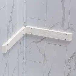White corner shower grab bar mounted on marble-look tiled walls with metal screws