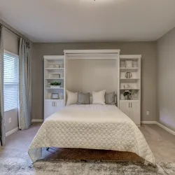 white cabinet wall bed pull down and with white comforter and grey and white pillows