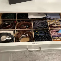 a shelf with a variety of shoes