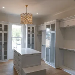 White cabinets and a chandelier