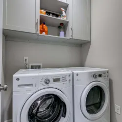 a washing machine and dryer in a room