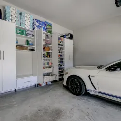 a white car parked in a room