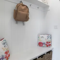 a purse on a wall in a mud room