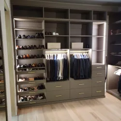 a closet with a variety of clothes