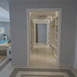 A master room with a custom walk through closet