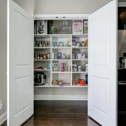 a white shelving unit with shelves