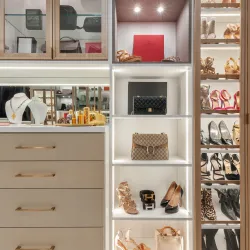 a luxury closet with designer shoes handbags and jewelry