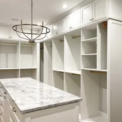 a kitchen with white cabinets