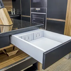 a kitchen with a sink and a wooden bench