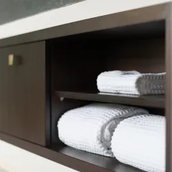 a shelf with towels on it