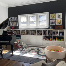 a room with a piano and a rug