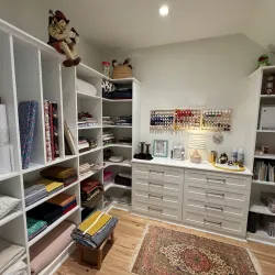 a room with shelves and a chair