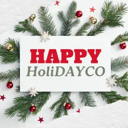 Christmas card with Happy Holidays message surrounded by pine branches, red and gold ornaments, and red stars