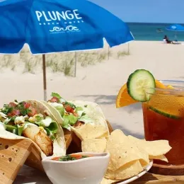 a plate of food on a beach