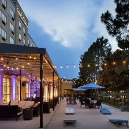 a building with a patio and tables