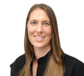 Smiling woman with long brown hair, wearing a black shirt, against a transparent background.