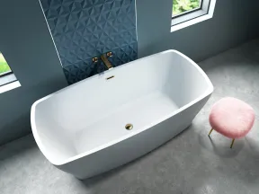 Modern white freestanding bathtub with gold fixtures next to a blue textured wall and pink fluffy stool.