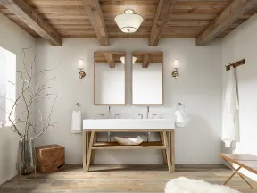 Modern rustic bathroom with wood beamed ceiling, double sinks, large mirrors, and minimalist decor