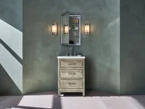 Bathroom vanity with sink, open mirrored medicine cabinet, and wall sconces against green textured wall